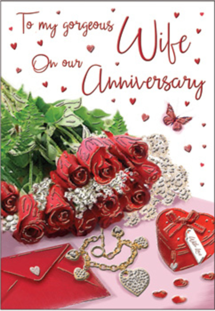 A rich, emotive anniversary tableau is presented here, composed around a classic bouquet of deep red roses that immediately draws the eye. Every bloom appears luxuriously full, the petals layered thickly and curling outward as if in a slow, fragrant exhale, capturing the essence of a hand-tied arrangement carried carefully through the streets of Brentwood. The roses are embraced by lush greenery, long stems and leaves adding a sense of natural abundance, like foliage glimpsed on a weekend stroll down Shenfield Road in early summer. Beside the bouquet lies an elegant jewellery set, perhaps chosen after thoughtful browsing in local boutiques: delicate pieces that catch the light with soft, golden glimmers. A vivid red box mirrors the intensity of the roses, its smooth surface and precise corners suggesting a treasured gift that has been lovingly wrapped. Lace-like detailing and delicate heart motifs weave through the background, adding layers of texture and romance, as though draped fabric and decorations had been arranged on a table laid for an anniversary dinner. The card's message is set in graceful script, each letter carefully curved, echoing the way couples choose their words slowly when they truly matter. Velvet, silk, and barely suggested metallic accents interplay beneath a warm, diffused light that softens every edge and shadow, creating a feeling of closeness and safety. The mood is unmistakably romantic yet grounded in reality, portraying the sort of heartfelt celebration that might take place in a Brentwood living room: roses opened in their vase, jewellery gleaming from its box, and quiet words of appreciation exchanged between two people who have shared many seasons side by side.